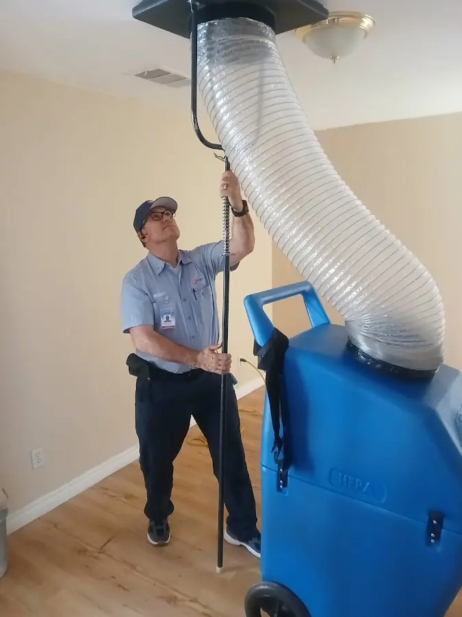 Furnace Tune-Up technician using HEPA equipment in West Ocean City